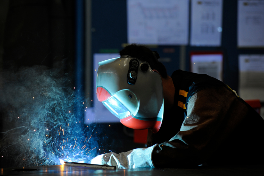 A metalworker undergoing metalworking - Arrow Manufacturing Group - CNC Manufacturing Company